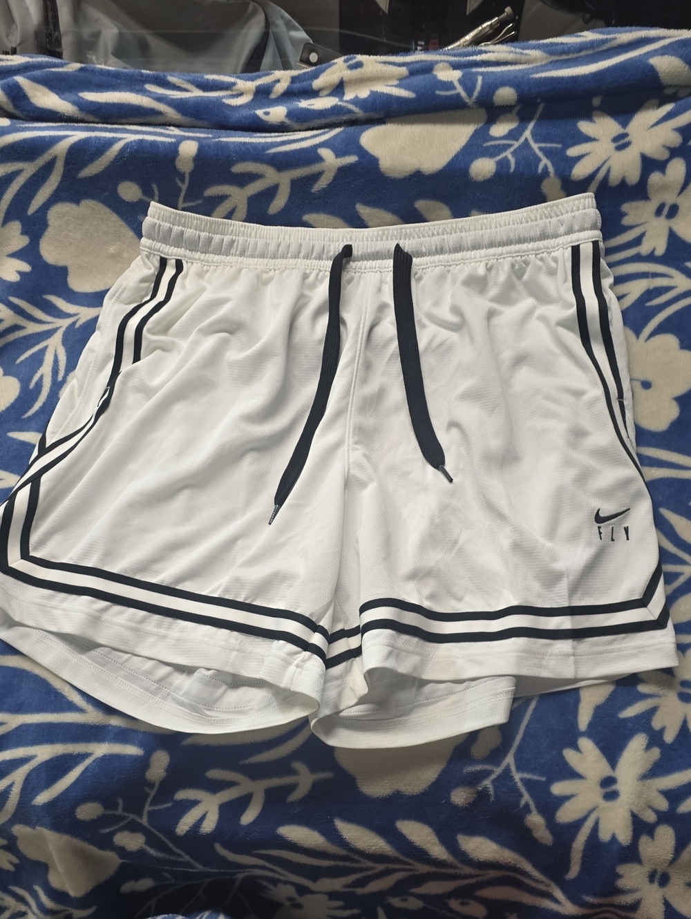 Nike White Athletic Shorts with Black Trim and Drawstring